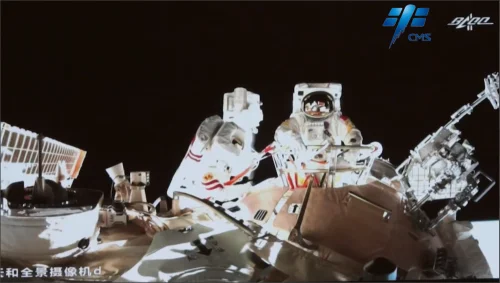 Shenzhou XIII China's Shenzhou 13 astronauts Zhai Zhigang and Wang Yaping wave to a camera during their mission's first spacewalk on Nov. 7, 2021 at the Tiangong space station core module Tianhe. One of the main tasks during the excursion was installing a dual-arm connector to Tianhe's 32.8-foot-long (10 meters) robotic arm. The connector  allow the arm to join with a smaller, 16-foot (5 m) arm.